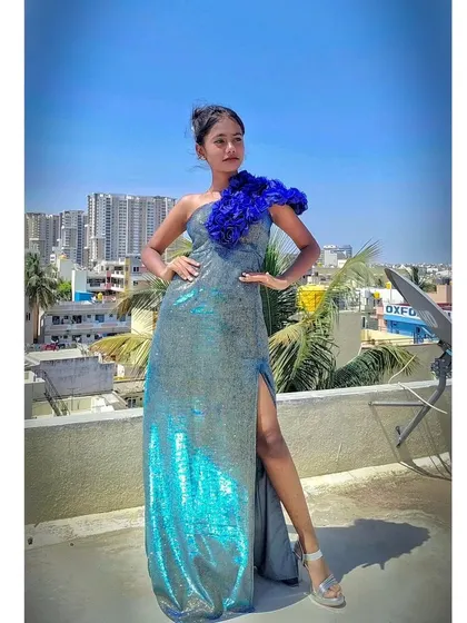 The shimmering fabric of this gown catches the sunlight beautifully in this rooftop shot.