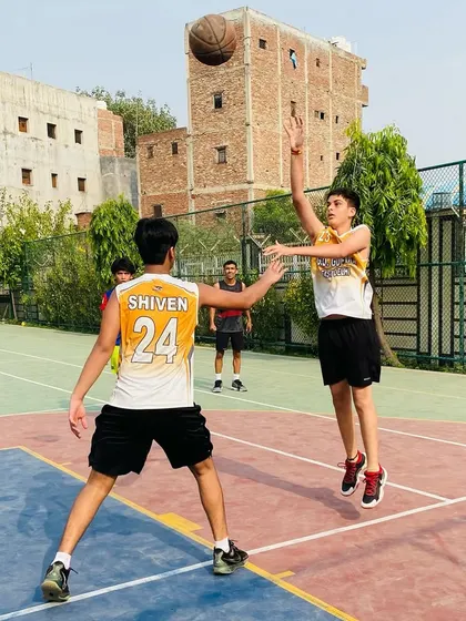 A player takes a mid-range jump shot, a critical skill for any offensive player.