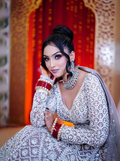 A close-up portrait in the pastel lavender lehenga, capturing a moment of quiet grace.