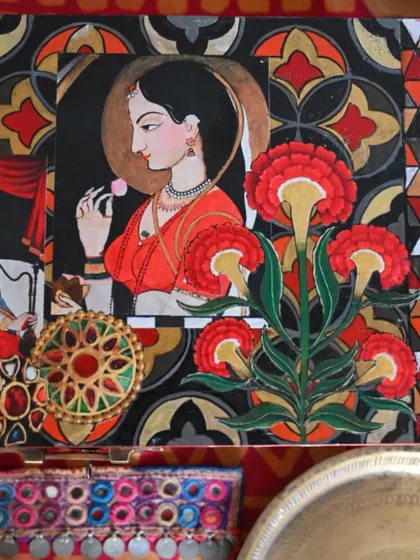 A top-down detail of the lid, showcasing a beautiful portrait inspired by Indian miniature painting. The surrounding floral and geometric patterns add to its romantic and nostalgic feel.