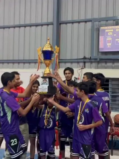 The moment of victory. Team Hoopnotics lifting the championship trophy for the Youth Basketball League Season 1.