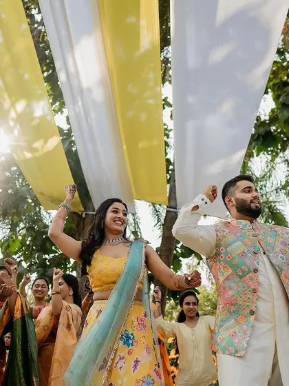 A collection of fun and vibrant moments from a sun-drenched Haldi. From playful entries to candid portraits, we capture the complete story of this joyous celebration.