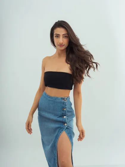 A simple, direct-to-camera shot. The clean makeup and casual styling create a fresh, approachable, and modern look.