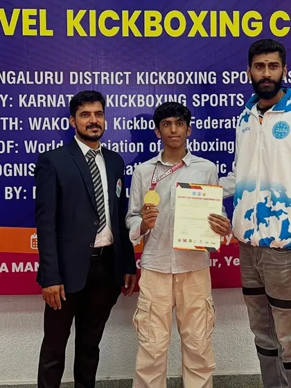 My student with his gold medal at the WAKO Karnataka State Level Kickboxing Championship.