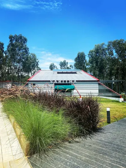 The Saritha Serene marketing office, with its industrial aesthetic, is softened by a border of ornamental grasses. This juxtaposition of hard and soft, man-made and natural, is a recurring theme in my work.