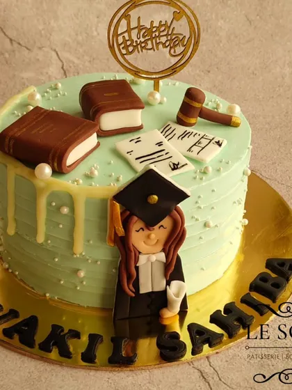 One for the lawyer. This 1 kg Chocolate Butterscotch cake celebrates a legal professional with a 2D fondant figurine, law books, and a gavel.