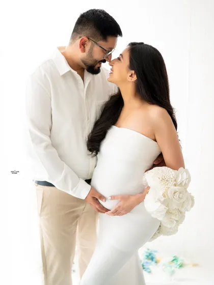 A classic nose-to-nose pose that is so full of love and anticipation. The all-white theme is pure and timeless.