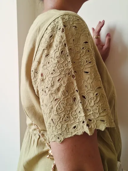 The beautiful embroidered sleeve detail on this dress adds a touch of craftsmanship and elevates it from a simple basic.
