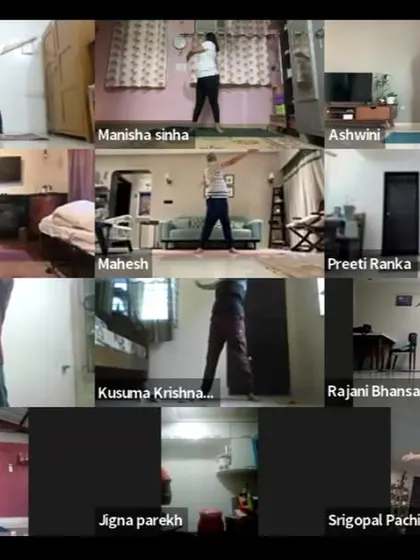 Participants engage in standing warm-up exercises during our early morning online class. These movements prepare the body for deeper postures by increasing blood flow and loosening the joints.