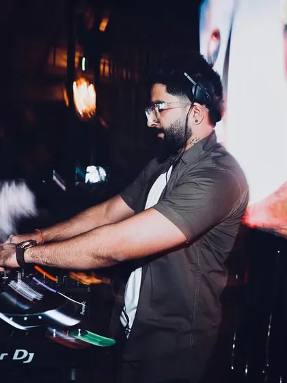 A motion blur shot capturing the fast-paced energy of a live set. This image reflects the dynamic and constantly moving environment of a club night.