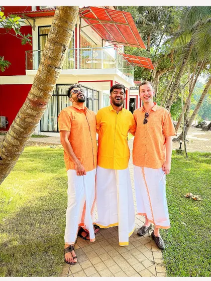 The groom and his groomsmen enjoying the relaxed vibe of a Goa wedding, dressed in traditional veshtis with a modern twist.