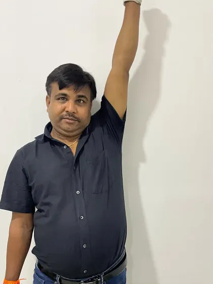 The final result of Mr. Hukum's treatment. Being able to raise his arm straight up without pain is a testament to his hard work and our collaborative therapeutic approach.