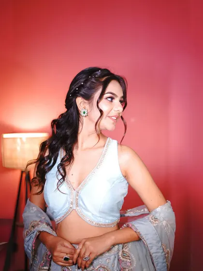 Another portrait in the blue floral lehenga, showing its soft and feminine appeal.