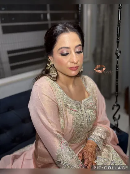 This close-up shows the soft curls and the elegant twist of the hairstyle, which is perfect for an engagement or Roka.