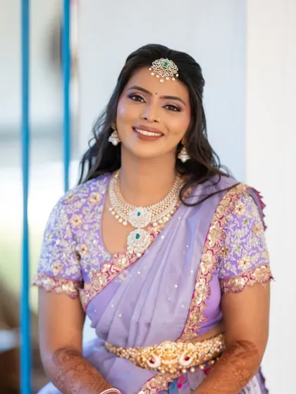 A beautiful smiling portrait of the bride in her unique lilac Langa Dhavani. The diamond jewelry perfectly complements the cool tones of the outfit.