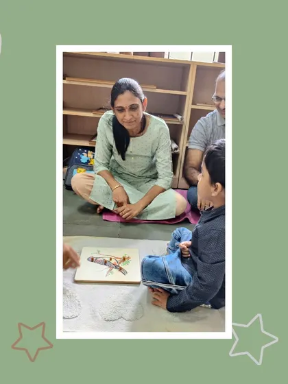 A child works with a puzzle of a bird, showing his parents what he has learned. These moments of shared discovery are what make our parent-teacher-child partnership so strong.