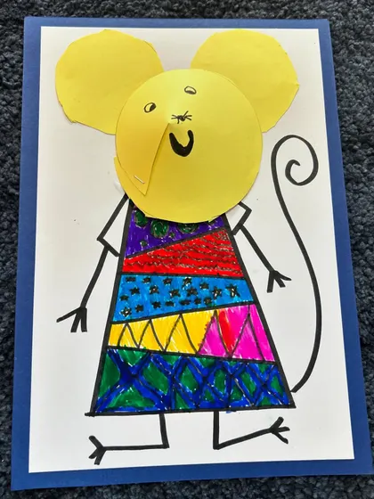 This yellow mouse has such a happy expression. The pattern work on the dress is so creative.