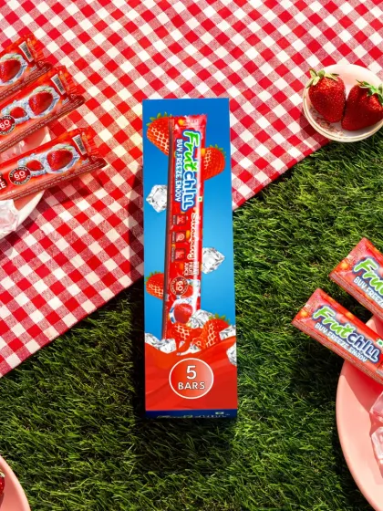 A picnic-themed shot for Fruitchill's strawberry flavor. The combination of artificial grass, a gingham cloth, and fresh strawberries creates a playful, outdoor scene that’s perfect for the brand.