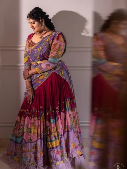A beautiful portrait for a housewarming ceremony. Her stunning, colorful lehenga is a piece of art itself, and the motion in the reflection adds a dynamic feel to the image.