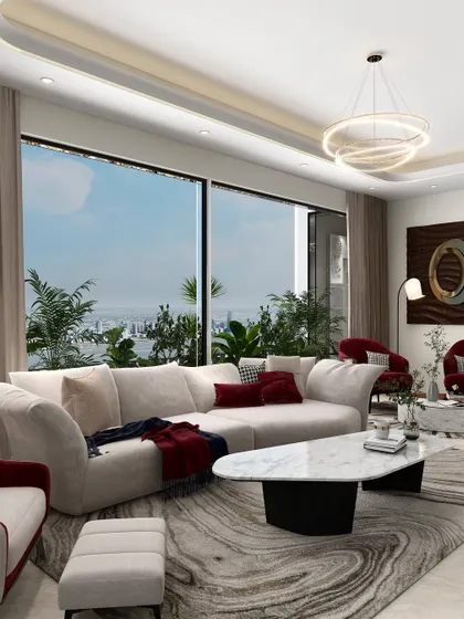 This angle highlights the custom-designed furniture that shapes this expansive living room. The organic shape of the sofa is complemented by the fluid pattern on the rug and the unique, pebble-like form of the marble coffee table.
