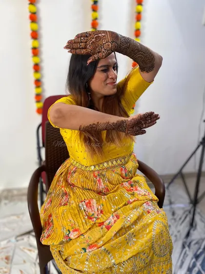 Another pose from the happy bride with her mandala mehendi.