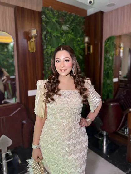 This beautiful client wanted a soft day glam look, and we were happy to deliver. The makeup is light and radiant, perfect for her elegant dress.