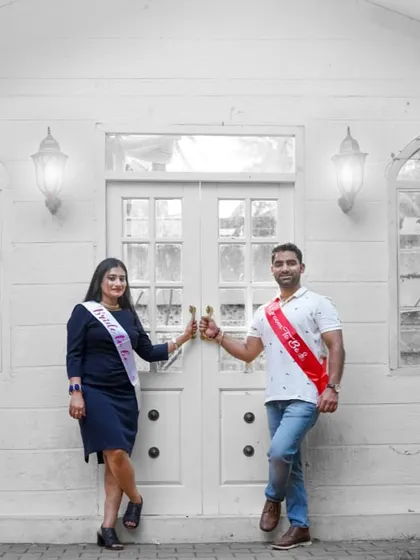 A fun "Bride to be" and "Groom to be" shot from a pre-wedding session, using sashes to announce their upcoming wedding.