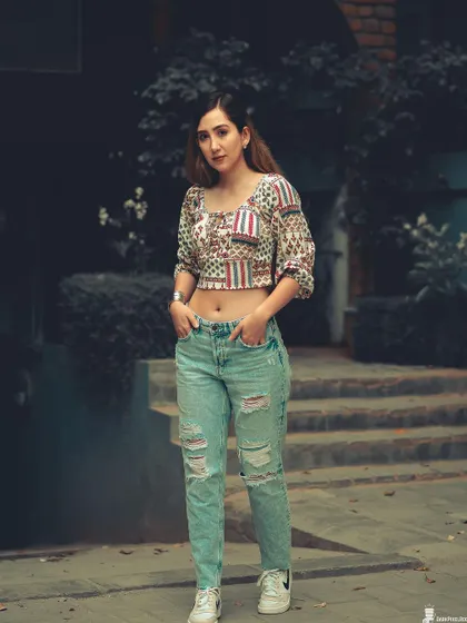 A full-body street style shot that showcases attitude and fashion. The cool-toned color grading and urban setting create a modern, grunge-inspired look.