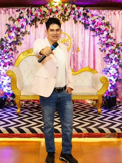 A professional shot of me on stage, ready to host your next big event.