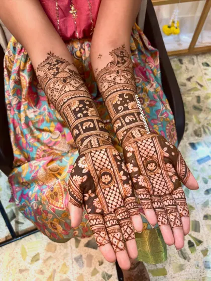 A full view of the intricate bridal mehendi, showcasing the detailed patterns and the rich color of the fresh henna paste.