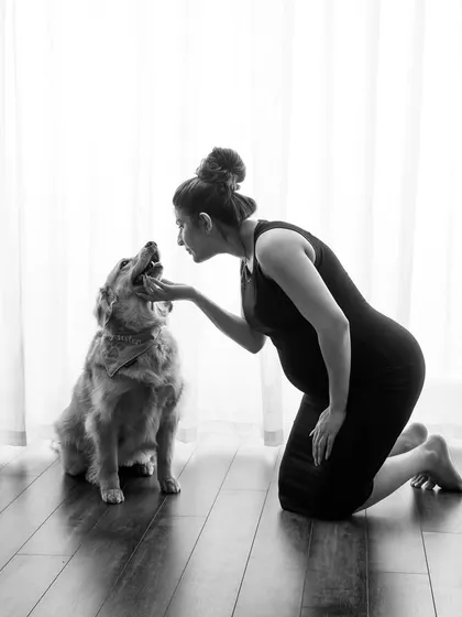 Our pets are family too! This black and white maternity portrait captures the gentle connection between an expecting mother and her furry best friend.