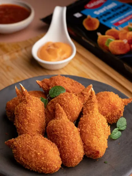 Crispy, golden-brown crab lollipops from Gadre Seafood. We styled this shot to look like the perfect party appetizer, complete with a creamy dip.