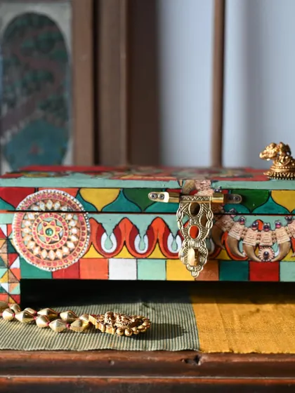 The front view of the box, showcasing the detailed patterns and a beautiful latch. This piece is a mix of hand-painting and decoupage, a process I use to create affordable yet intricate art.