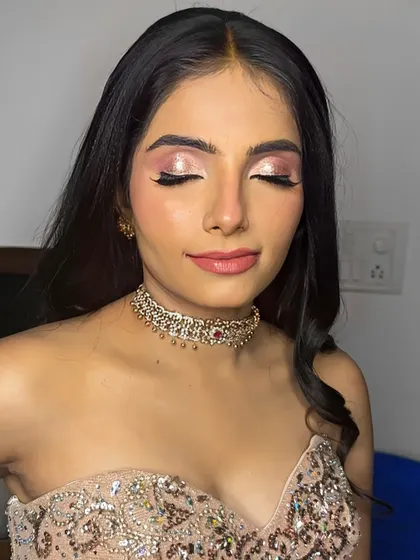 A close-up of the eye makeup. I used a shimmering rose gold shadow to create a look that is both trendy and timeless.