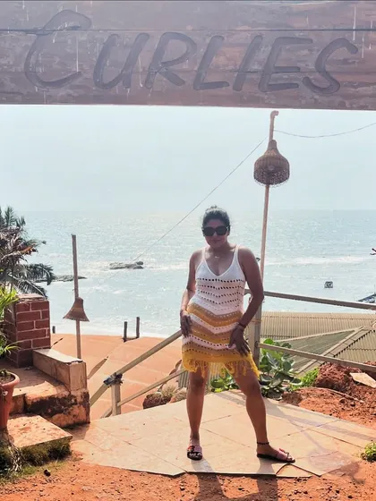 A casual beach look from Goa, featuring a crochet dress with fringe details. Perfect for a relaxed day by the sea.