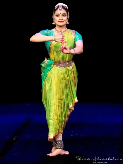 A graceful pose from a performance at the South Asian Heritage Month Festival in London, showcasing the classic lines of Bharatanatyam.
