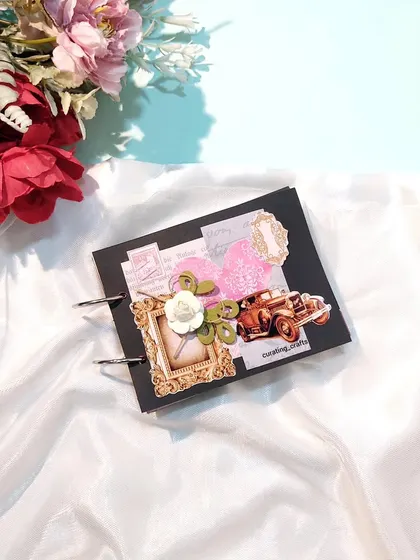 The cover of the vintage ring-bound album, featuring a 3D car embellishment and a classic frame.