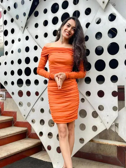 A confident pose before an event. My job is to be a free soul who follows her heart, and that energy translates into a lively and authentic hosting style.