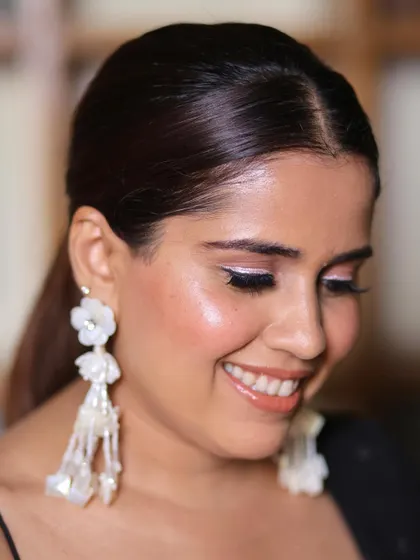 A touch of makeup magic for this bridesmaid. I gave her glowing skin with a hint of white shimmer on the inner corner of her eyes to make them sparkle.