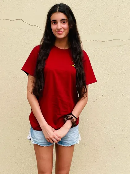 One of my talented swimmers, Veera Prathambir, sporting our new team shirt.