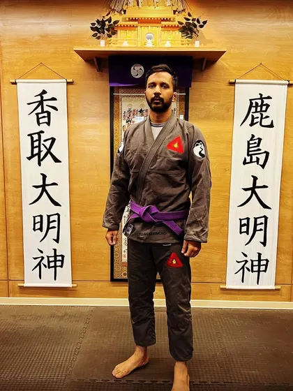 Our instructor, representing The Dojo, after a training session. We believe in leading by example, with our coaches actively training and growing alongside our students.