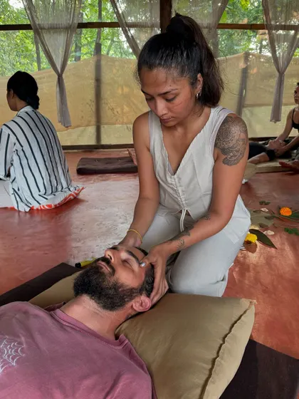 Beyond sound, I also offer hands on bodywork. Here, I am applying gentle pressure during a Thai massage session, a practice that complements sound healing by releasing physical tension stored in the body.