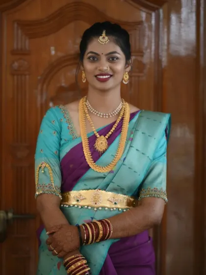 A full-length view of this happy client. The makeup is designed to be camera-ready, ensuring she looks fantastic in all the photos from the event.