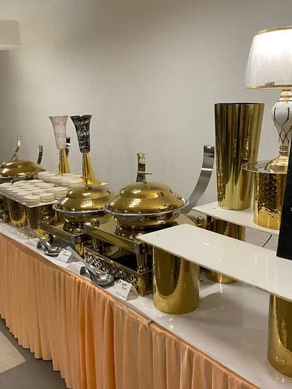 A closer look at our main course station. The custom signage clearly labels the section, while the premium chafing dishes and table lamps demonstrate our focus on a high-end presentation for every part of the meal.
