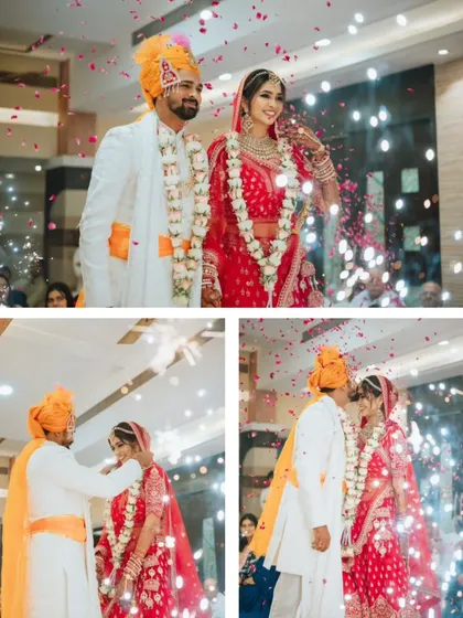 The grand 'varmala' ceremony with a shower of petals and sparklers, creating a festive atmosphere.