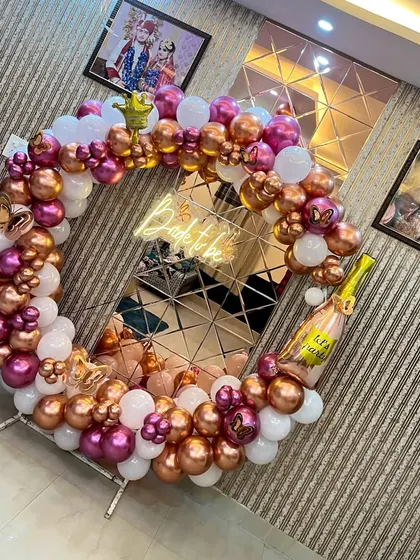 An angled shot of the 'Bride to be' ring decoration, showcasing the mix of metallic and matte balloons.