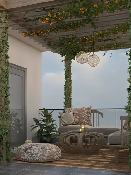 This cozy balcony nook under a pergola is perfect for enjoying a morning coffee, with comfortable seating and decorative lighting.