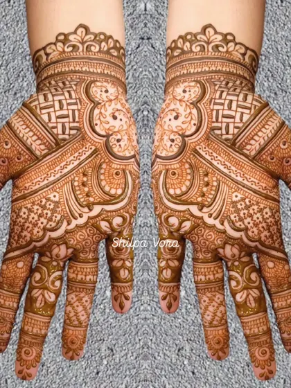 A symmetrical design with a unique woven pattern on the palm and wrist.