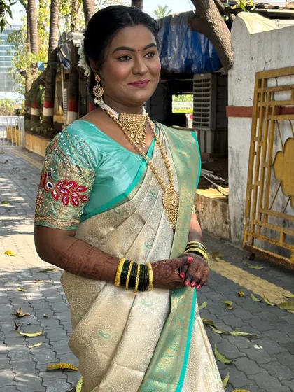 The complete look, showcasing the beautiful saree and the radiant makeup.