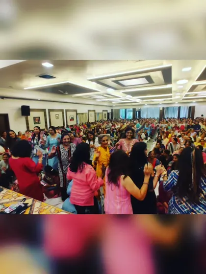 The entire hall is on its feet, dancing and celebrating during a Musical Housie event. This image captures the immense fun and participation that my interactive sessions generate.